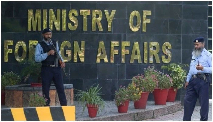 Two guards stand outside of the Ministry of Foreign Affairs office in Islamabad, Pakistan. — AFP/file