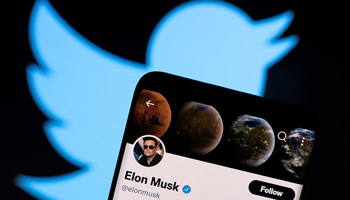 Elon Musks Twitter account is seen on a smartphone in front of the Twitter logo in this photo illustration taken, on April 15, 2022. — Reuters