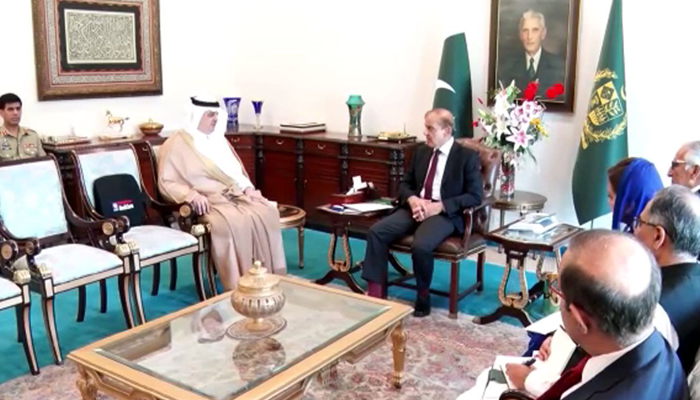 Prime Minister Shehbaz Sharif (centre) meets Saudi Ambassador to Pakistan Nawaf Bin Saeed Al-Maliki (left) at the PMs Office in Islamabad, on April 18, 2022. — RadioPakistan