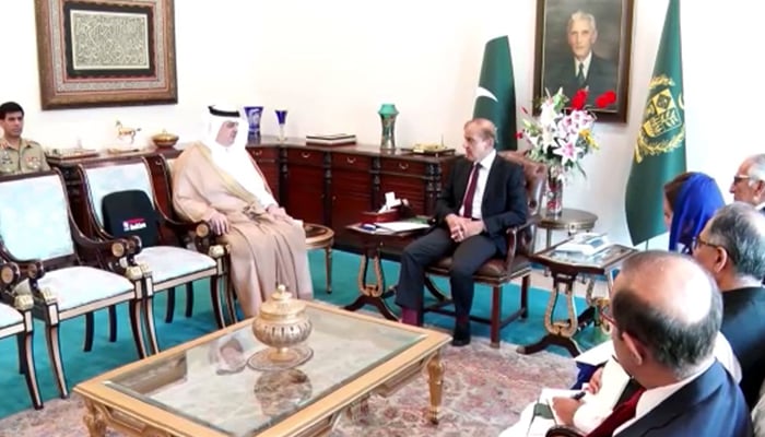 Prime Minister Shehbaz Sharif (centre) meetsSaudi Ambassador to Pakistan Nawaf Bin Saeed Al-Maliki (left) at the PMs Office in Islamabad, on April 18, 2022. — RadioPakistan