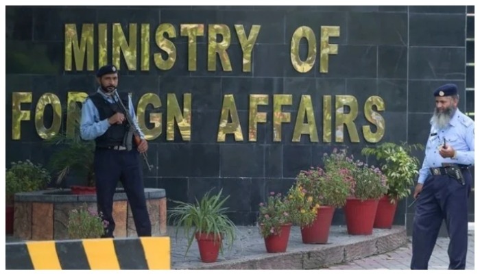 Security guards stand outside the Ministry of Foreign Affairs in Islamabad. — AFP