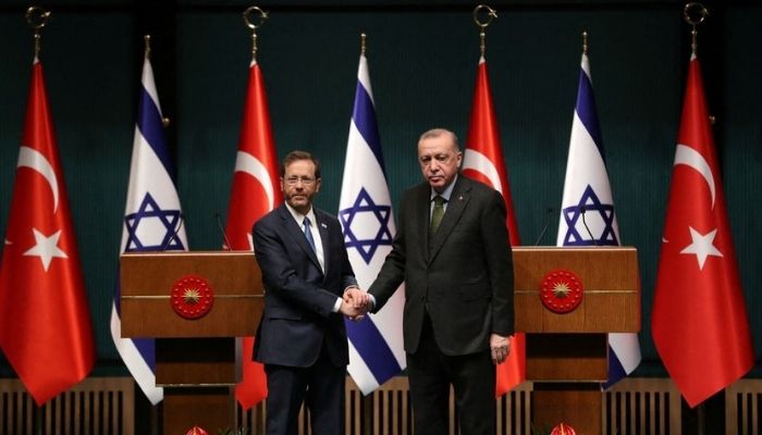 Turkish President Tayyip Erdogan and his Israeli counterpart Isaac Herzog shake hands during a joint news conference in Ankara, Turkey March 9, 2022. — Reuters