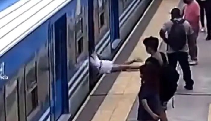 Footage captures woman tipping forward and stumbling towards the incoming train. Screengrab via Twitter/@DiamondLouX