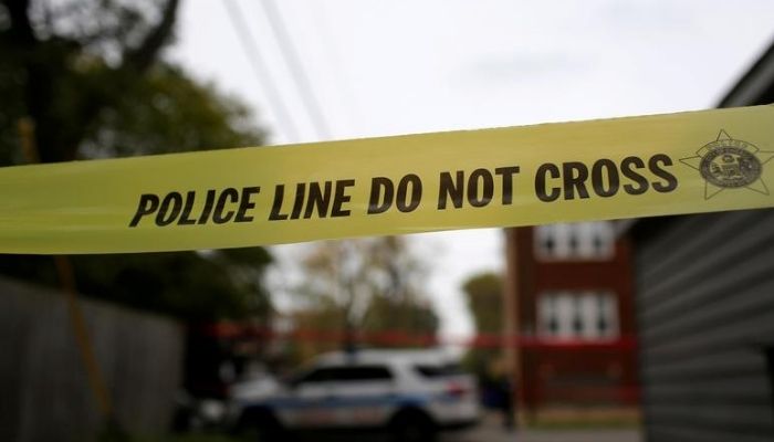 Yellow police tape is displayed at a crime scene after a motorist was shot in the head along the 2700 block of south 80th Street in Chicago, Illinois, U.S., November 1, 2017. — Reuters