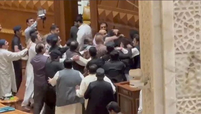 This screengrab shows PTI members attacking Dost Mohammad Mazari inside Punjab Assembly. — Screengrab via YouTube/ Geo News Live