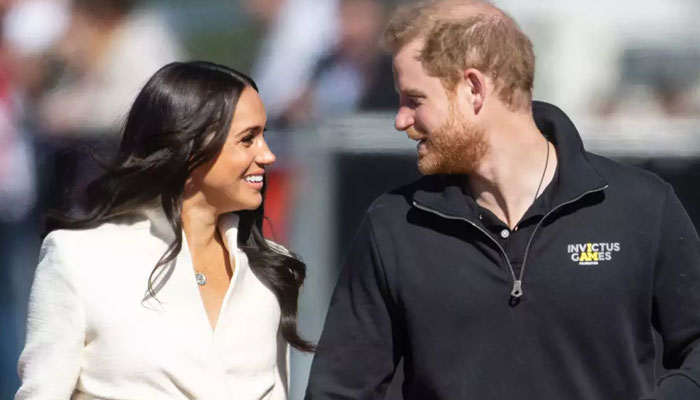 Meghan trolled for holding Harrys hand to fight his bubbling omelette of grievance