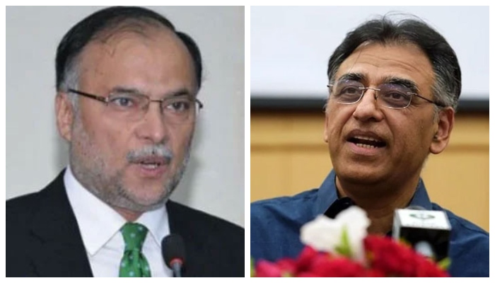 Federal Minister Planning, Development and Special Initiatives Ahsan Iqbal (left) and his predecessor Asad Umar. — Files