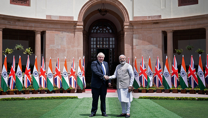 Britains Prime Minister Boris Johnson (L) shakes hands with his Indian counterpart Narendra Modi before their meeting at the Hyderabad House in New Delhi on April 22, 2022. — AFP