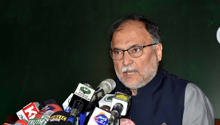 Minister for Planning and Development Ahsan Iqbal addressing the media in Lahore. — PID