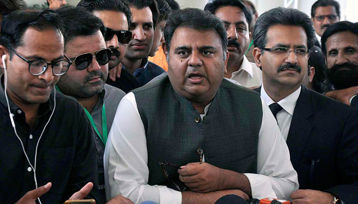 PTI leader Fawad Chaudhry talking to the media outside the Supreme Court in this file photo. — APP/File
