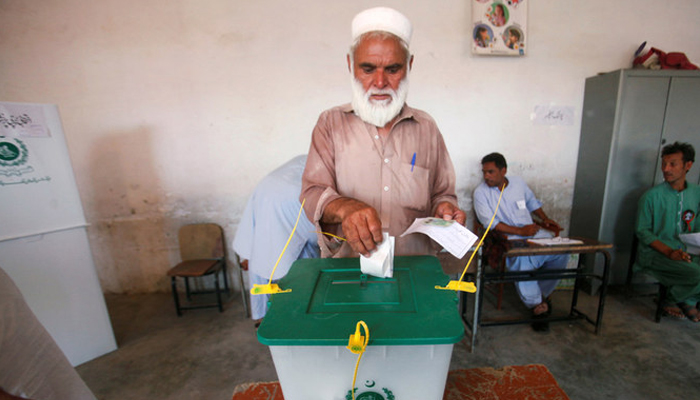 In this file photo, a voter casts his vote at a polling station during the first provincial elections in Jamrud, Pakistan, on July 20, 2019. — Reuters
