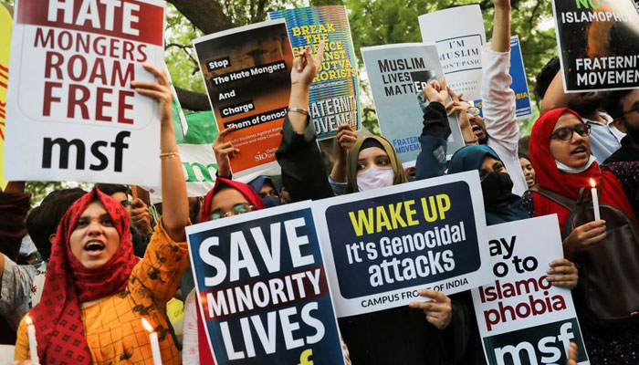 Citizens shout slogans and hold placards during a peace vigil organised by citizens against what they say is rise in hate crimes and violence against Muslims in the country, in New Delhi, India, April 16, 2022. — Reuters/File