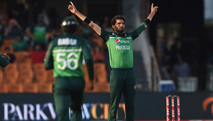 Pakistan’s Shaheen Afridi (R) celebrates the wicket of Australia’s Jason Behrendorff (not pictured) during the third and final one-day international (ODI) cricket match between Pakistan and Australia at the Gaddafi Cricket Stadium in Lahore, on April 2, 2022. — AFP
