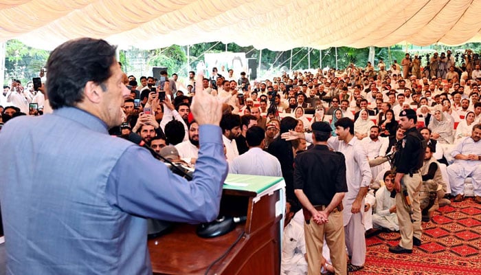 Former prime minister and PTI Chairman Imran Khan addresses his workers during the worker convention held at CM House in Peshawar on Tuesday, April 26, 2022. — PPI