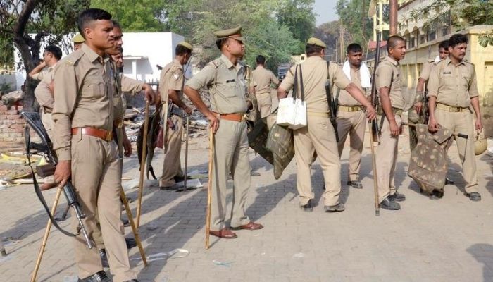 Policemen stand outside a park, a day after clashes between police and squatters, in Mathura, India June 3, 2016.— Reuters
