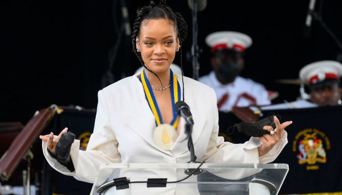 Pregnant Rihanna cherishes memories as a national hero