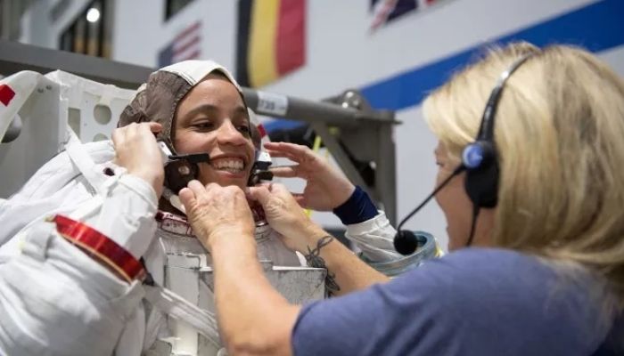 NASA astronaut Jessica Watkins puts on a spacesuit ahead of underwater training at NASAs Johnson Space Center in Houston.—NASA