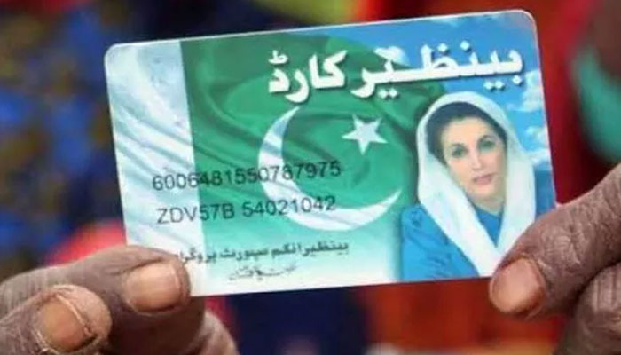 A beneficiary showing the Benazir Income Support Programme Card. — APP/File