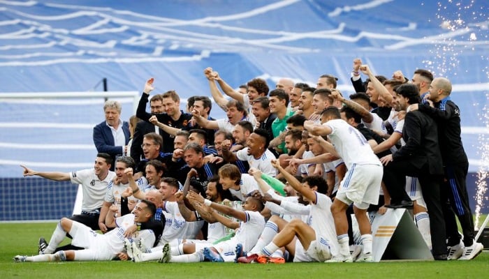 Soccer Football - LaLiga - Real Madrid v Espanyol - Santiago Bernabeu, Madrid, Spain - April 30, 2022 Real Madrid team members celebrate after winning LaLiga. — Reuters