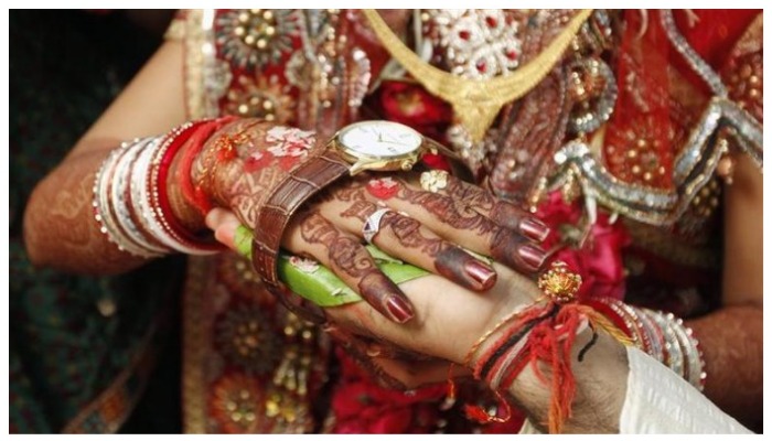 Bride and groom exchange wedding vows inside a hospital in Ahmedabad February 17, 2012. — Reuters/Amit Dave