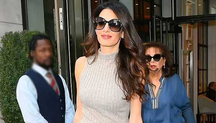 Amal Clooney stuns onlookers as she puts on a stylish display in knitted vest and flared jeans