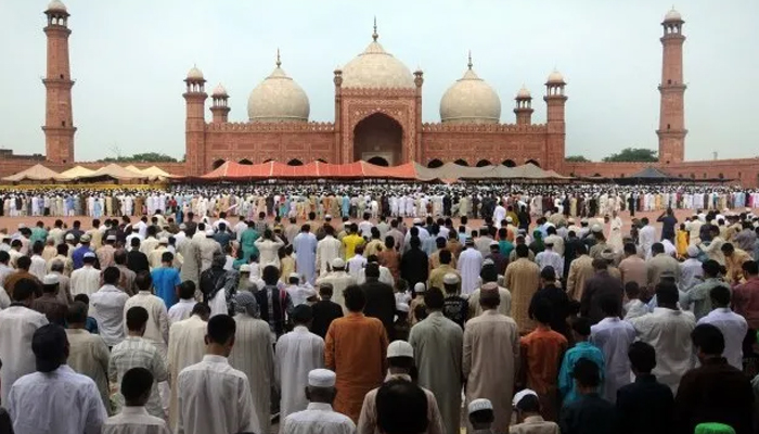 Pakistani Muslims offer Eid-ul-Fitr prayers at the Badshahi Mosque during the first day of their religious festival in Lahore on August 9, 2013. — AFP