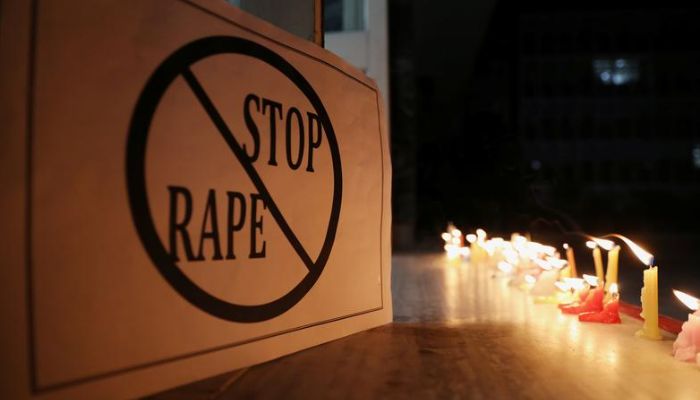 A poster is seen at a candle-lit march by the resident doctors and medical students from All India Institute Of Medical Sciences (AIIMS) to protest against the alleged rape and murder of a 27-year-old woman on the outskirts of Hyderabad, in New Delhi, India, December 3, 2019.— Reuters