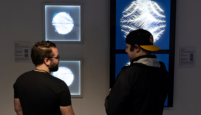 Visitors gather for ’The Climate Conversation’ exhibition at Seattle NFT Museum, the first permanent blockchain-based digital art museum in the world, in Seattle, Washington, US, on April 16, 2022. — Reuters