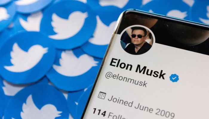 Elon Musks Twitter profile is seen on a smartphone placed on printed Twitter logos in this picture illustration taken April 28, 202.— Reuters
