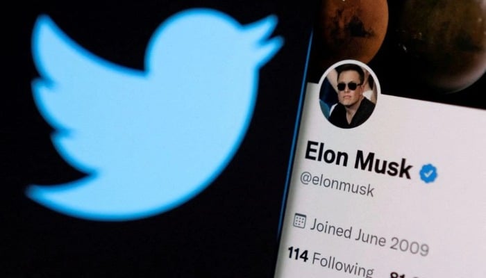 Elon Musks Twitter account is seen on a smartphone in front of the Twitter logo in this photo illustration taken, April 15, 2022. — Reuters/File