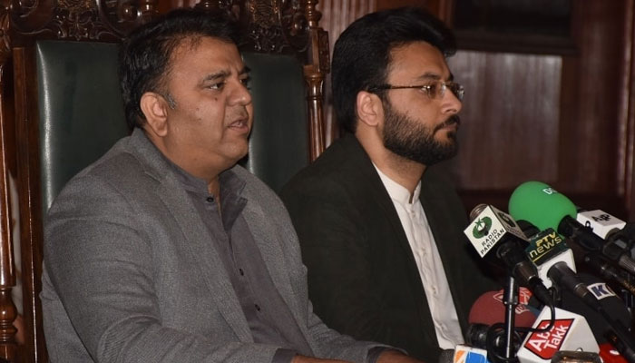 Former information minister and senior PTI leader Fawad Chaudhry (L) addressing a press conference flanked by PTI leader Farrukh Habib. — PID/File