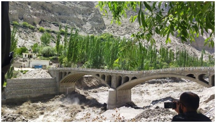 Hassanabad Bridge built under CPEC, connecting the Hunza Valley to Pakistan, has given way to massive Glacial Lake Outburst Flood on May 7, 2022. — Twitter/ShabbirMir