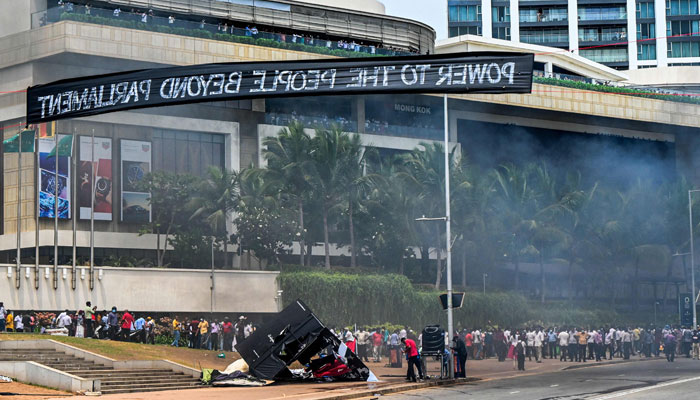 Demonstrators and government supporters clash outside the Presidents office in Colombo on May 9, 2022. — AFP