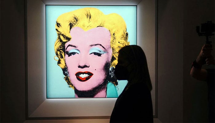 Warhol’s famed ‘Marilyn’ silk-screen sells for record $195 million at auction