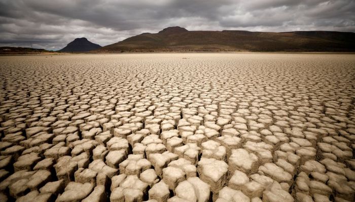 Clouds gather but produce no rain as cracks are seen in the dried up municipal dam in drought-stricken Graaff-Reinet, South Africa, November 14, 2019.