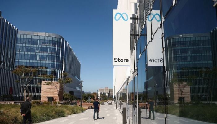 People walk past the first physical store of Facebook-owner Meta Platforms Inc in Burlingame, California, US May 4, 2022.— Reuters