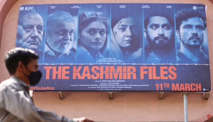 A man walks past a poster of Bollywood movie The Kashmir Files outside a cinema in Mumbai, India, March 16, 2022. — Reuters/File