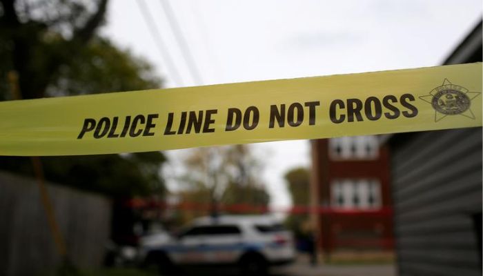 Yellow police tape is displayed at a crime scene after a motorist was shot in the head along the 2700 block of south 80th Street in Chicago, Illinois, US, on November 1, 2017.—Reuters