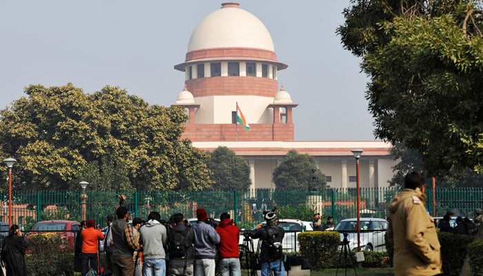 Television journalists are seen outside the premises of the Supreme Court in New Delhi, India, on January 22, 2020. — Reuters