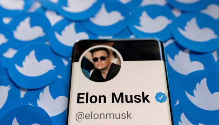 Elon Musks Twitter profile is seen on a smartphone placed on printed Twitter logos in this picture for illustration taken April 28, 2022.—Reuters