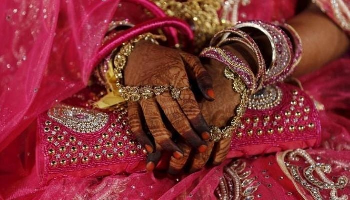 A bride waits for the start of a mass marriage ceremony in Mumbai, January 27, 2016. — Reuters