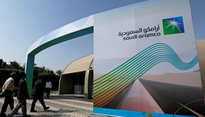 The logo of Aramco is seen as security personnel walk before the start of a press conference by Aramco at the Plaza Conference Center in Dhahran, Saudi Arabia November 3, 2019. — Reuters/File