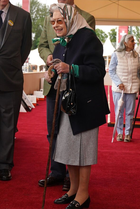 Queen defies wheelchair reports, uses walking stick at beloved event