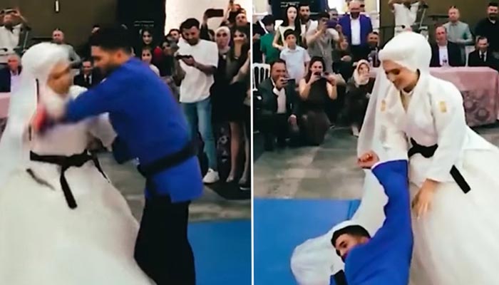 The picture shows a bride and groom showcasing their judo skills.  Screengrab/YouTube