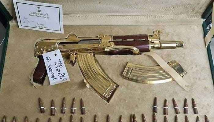 A golden AK-47, priced at Rs600,000, is also one of the items put on sale by the authorities. The image also shows 30 bullets along with the gun. Photo: geo.tv