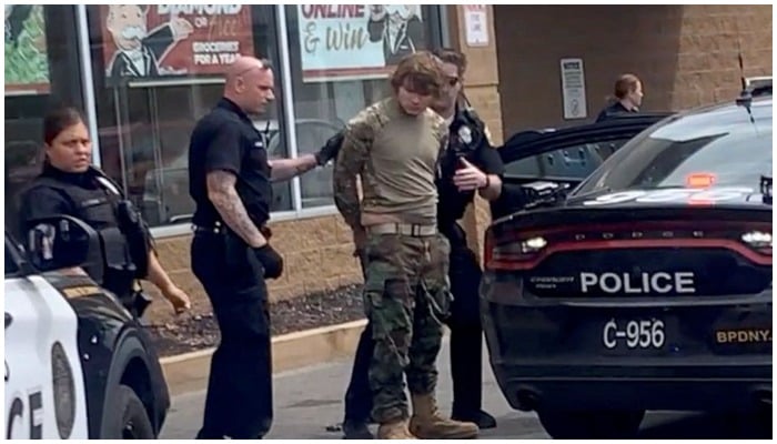 A man is detained following a mass shooting in the parking lot of TOPS supermarket, in a still image from a social media video in Buffalo, New York, US May 14, 2022. Courtesy of BigDawg/ via REUTERS