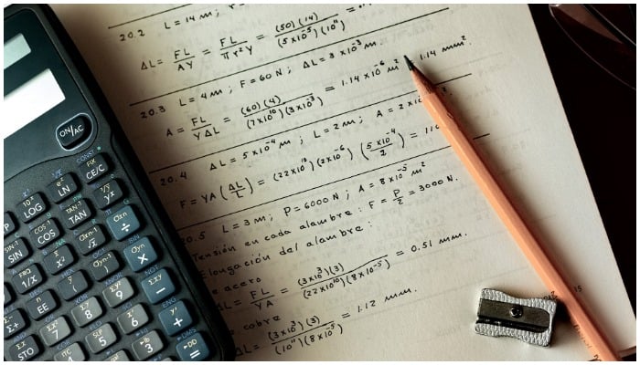 Image showing a calculator, a pencil, a sharpener, and a paper with some mathematical equations written on it. — Pixabay/ MarandaP