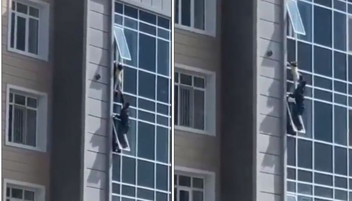 Man in Kazakhstan saves a three-year-old girl from falling from a height of at least 100-feet. — Screengrab from Twitter/@akakakakakjy