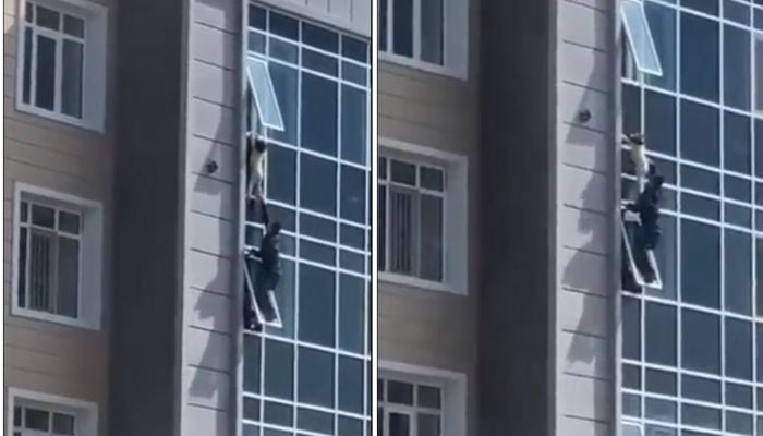 Man in Kazakhstan saves a three-year-old girl from falling from a height of at least 100-feet. — Screengrab from Twitter/akakakakakjy