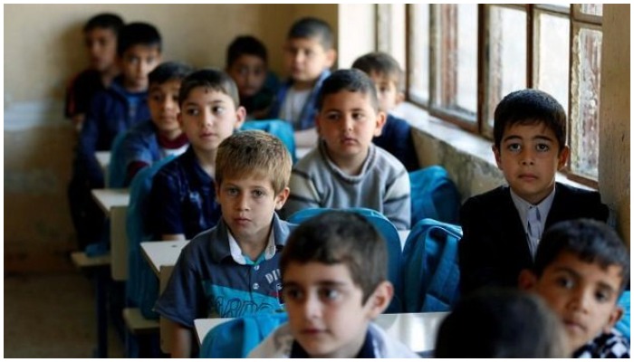 School children sit in a classroom in a school in Pakistan. — Reuters/File